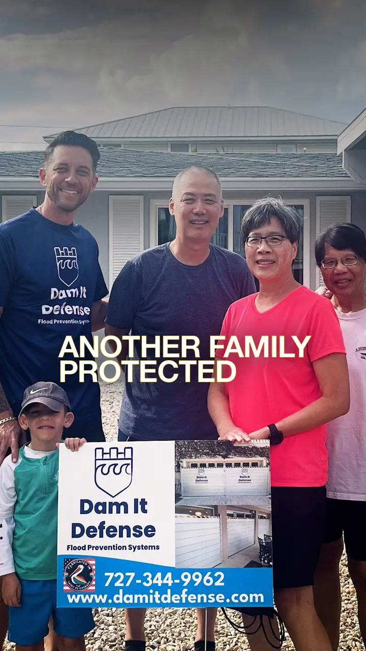 Dam It Defense crew with a protected St. Pete family